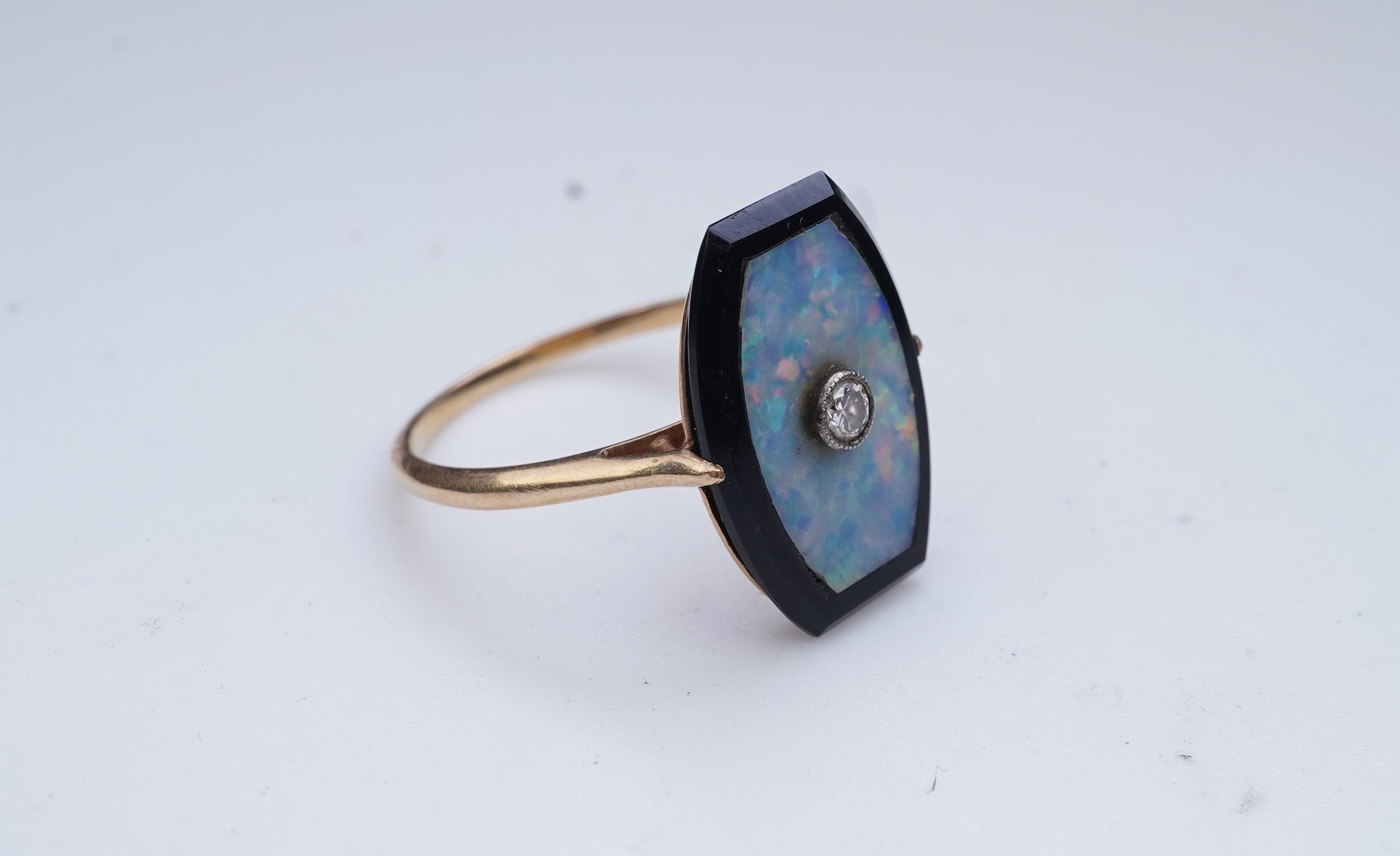 An opal, onyx and diamond ring, early 20th century composite